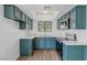 Eat-in kitchen featuring modern appliances, ample counter space, and sleek cabinets for storage at 7200 Pirates Cove Rd # 2089, Las Vegas, NV 89145