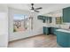 Bright eat in kitchen with new cabinets, white counters, updated appliances and an expansive view from the window at 7200 Pirates Cove Rd # 2089, Las Vegas, NV 89145