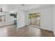 Bright living room with beautiful laminate floors and view to the balcony at 7200 Pirates Cove Rd # 2089, Las Vegas, NV 89145