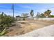 Spacious backyard area featuring a neutral-colored privacy fence, and desert landscaping at 728 Carpenter Dr, Las Vegas, NV 89107