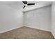 Bright bedroom features neutral walls, plush carpet, and a ceiling fan for comfortable living at 728 Carpenter Dr, Las Vegas, NV 89107