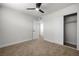 A well-lit bedroom features plush carpet and includes a closet and doorway at 728 Carpenter Dr, Las Vegas, NV 89107