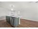 Quartz island with stainless steel dishwasher in a well-lit modern kitchen at 728 Carpenter Dr, Las Vegas, NV 89107