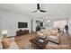Bright, staged living room boasts a ceiling fan and updated decor at 728 Carpenter Dr, Las Vegas, NV 89107