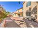 Landscaped backyard with brick pavers and rock ground cover surrounding the home at 7709 Tiny Tortoise St, Las Vegas, NV 89149
