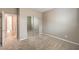Neutral bedroom features plush carpet and a mirrored closet at 7709 Tiny Tortoise St, Las Vegas, NV 89149