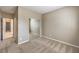 Bedroom features sliding mirror closet doors, beige walls, and patterned carpet at 7709 Tiny Tortoise St, Las Vegas, NV 89149
