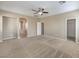 Spacious primary bedroom with neutral walls and plush carpeting at 7709 Tiny Tortoise St, Las Vegas, NV 89149