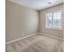 Neutral bedroom features beige walls, patterned carpet and a window with shutter-style blinds at 7709 Tiny Tortoise St, Las Vegas, NV 89149