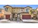 Inviting two-story home with desert landscaping, two-car garage and a tile roof on a sunny day at 7709 Tiny Tortoise St, Las Vegas, NV 89149