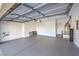 Spacious, freshly painted two car garage with epoxy flooring and water heater at 7709 Tiny Tortoise St, Las Vegas, NV 89149