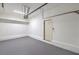 Clean two car garage with white walls, epoxy flooring and lighting at 7709 Tiny Tortoise St, Las Vegas, NV 89149