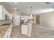 Modern kitchen with gas stove, stainless steel appliances, a large island, and granite countertops at 7709 Tiny Tortoise St, Las Vegas, NV 89149
