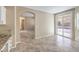 Open kitchen area with granite countertops and a view to the backyard at 7709 Tiny Tortoise St, Las Vegas, NV 89149