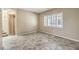 Spacious living room with tile floors, staircase and large windows at 7709 Tiny Tortoise St, Las Vegas, NV 89149