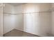 Spacious walk-in closet featuring carpet flooring and adjustable shelving to keep belongings organized at 7709 Tiny Tortoise St, Las Vegas, NV 89149