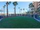 Fenced dog park with green turf, providing a safe and enjoyable space for pets and their owners at 8255 S Las Vegas Blvd # 1907, Las Vegas, NV 89123