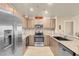 Modern kitchen features stainless steel appliances, granite countertops, and wood cabinetry at 8255 S Las Vegas Blvd # 1907, Las Vegas, NV 89123