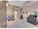 Living room featuring a modern cabinet, neutral color palette, and contemporary design at 8255 S Las Vegas Blvd # 1907, Las Vegas, NV 89123