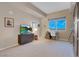 Living room featuring a modern cabinet, neutral color palette, and a mountain view at 8255 S Las Vegas Blvd # 1907, Las Vegas, NV 89123