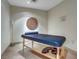 Calm massage room with neutral tones, dim lighting and a comfortable massage table at 8255 S Las Vegas Blvd # 1907, Las Vegas, NV 89123
