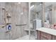 Shower featuring a glass enclosure, safety bar, and a built-in shelf at 8255 S Las Vegas Blvd # 1907, Las Vegas, NV 89123