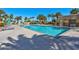 Inviting outdoor pool surrounded by palm trees and lounge chairs at 8255 S Las Vegas Blvd # 1907, Las Vegas, NV 89123