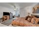 Comfortable bedroom featuring a ceiling fan, window seat, and sliding closet doors at 8657 Prairie Hill Dr, Las Vegas, NV 89134