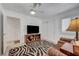 Comfortable bedroom with television and dual recliners at 8657 Prairie Hill Dr, Las Vegas, NV 89134