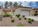 Charming single-Gathering home featuring manicured shrubs and a neatly maintained front yard at 8657 Prairie Hill Dr, Las Vegas, NV 89134