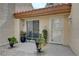 Inviting front porch with decorative planters, a bench, neutral tones, and textured walls at 8657 Prairie Hill Dr, Las Vegas, NV 89134