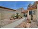 Desert-landscaped front yard with walkway leading to the entrance of the home at 8657 Prairie Hill Dr, Las Vegas, NV 89134