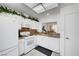 Efficient kitchen with white cabinetry overlooking the dining space at 8657 Prairie Hill Dr, Las Vegas, NV 89134