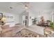 The open-concept living room with tile floors flows into the dining area at 8657 Prairie Hill Dr, Las Vegas, NV 89134