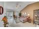 Comfortable living room features a neutral color palette and tile flooring throughout at 8657 Prairie Hill Dr, Las Vegas, NV 89134