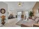 Open concept living and dining area with tile floors and seamless indoor-outdoor flow at 8657 Prairie Hill Dr, Las Vegas, NV 89134