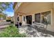Relaxing covered patio featuring outdoor seating and a peaceful view of the well-maintained yard at 8657 Prairie Hill Dr, Las Vegas, NV 89134