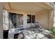 Charming covered patio with outdoor seating, perfect for enjoying the serene backyard ambiance at 8657 Prairie Hill Dr, Las Vegas, NV 89134