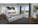 Serene primary bedroom with a large bed, stylish decor, and a scenic outdoor view at 883 Apatite Pl # Lot 57, Henderson, NV 89011