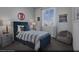 Cozy secondary bedroom with aviation decor, comfortable seating, and a view from the window at 883 Apatite Pl # Lot 57, Henderson, NV 89011