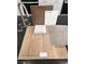 Selection of interior finishes featuring wood-look luxury vinyl plank, neutral carpet, quartz countertop, and sleek stainless faucet at 9241 Soho Sky Ct, Las Vegas, NV 89148
