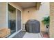 Cozy backyard patio area featuring a grill and lush green plants to create privacy at 1045 Spotted Saddle St, Henderson, NV 89015
