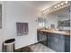 Bathroom with double sink vanity and granite countertops, providing elegance and functionality at 1045 Spotted Saddle St, Henderson, NV 89015