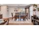 Warm dining area with wood table, seating for six, and neutral décor creating an inviting atmosphere at 1045 Spotted Saddle St, Henderson, NV 89015