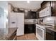 Well-equipped kitchen with stainless appliances, granite counters, and dark cabinets for a sleek look at 1045 Spotted Saddle St, Henderson, NV 89015