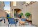 Inviting outdoor patio space with seating, fire pit, and lush greenery, perfect for relaxing at 1045 Spotted Saddle St, Henderson, NV 89015