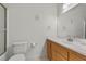 Bright bathroom with modern fixtures, single vanity, and tiled shower at 1077 Las Palmas Entrada Ave, Henderson, NV 89012