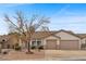 Charming single-story home with a well-maintained front yard and a spacious two-car garage at 1077 Las Palmas Entrada Ave, Henderson, NV 89012