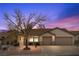 Charming single-story home with a well-maintained front yard and a spacious two-car garage at 1077 Las Palmas Entrada Ave, Henderson, NV 89012