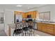 Open kitchen with stainless steel appliances, granite countertops, and wood cabinets at 1077 Las Palmas Entrada Ave, Henderson, NV 89012